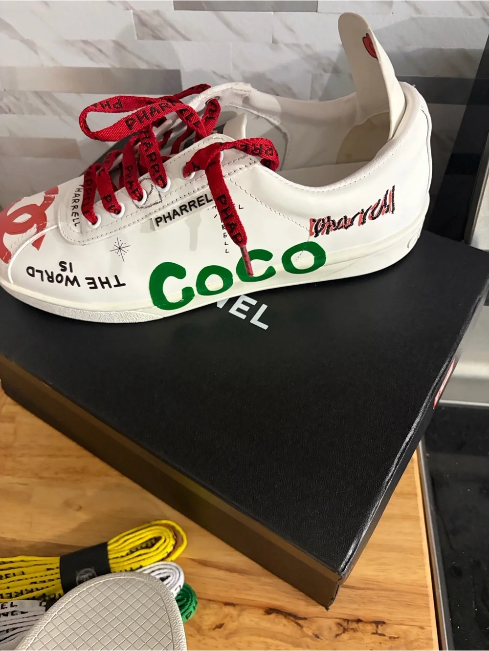 CHANEL White Kids Sneakers with Red and Navy Graphic Accents